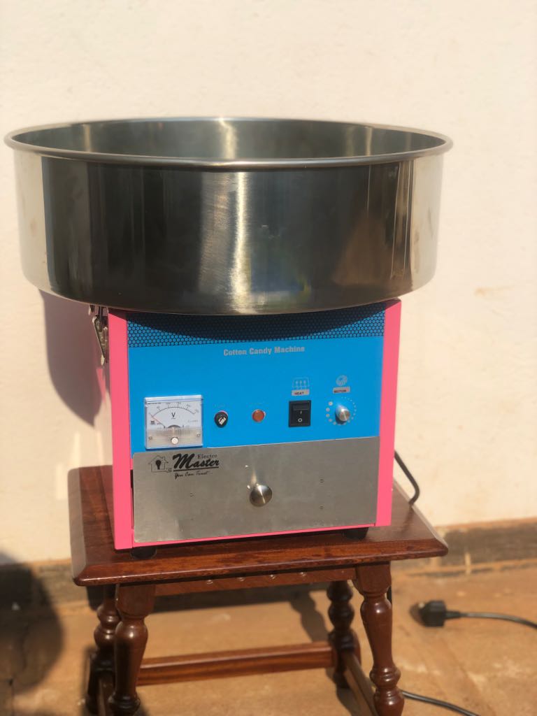A picture of Jumping castle and candy floss machine