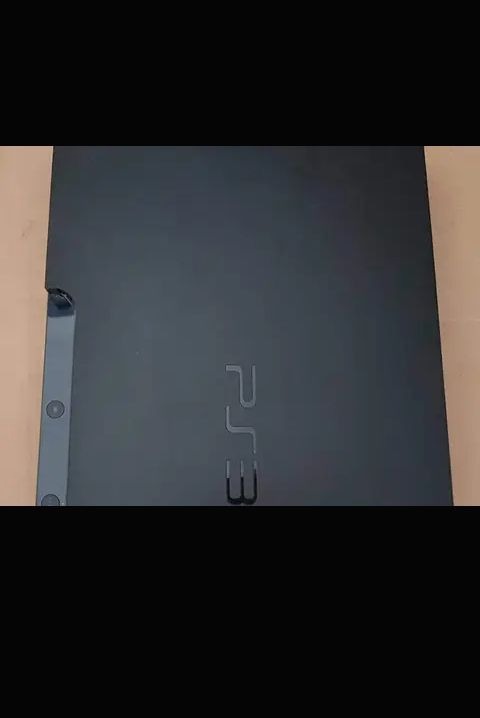 A picture of PlayStation 3 Console and Hitman Absolution CD
