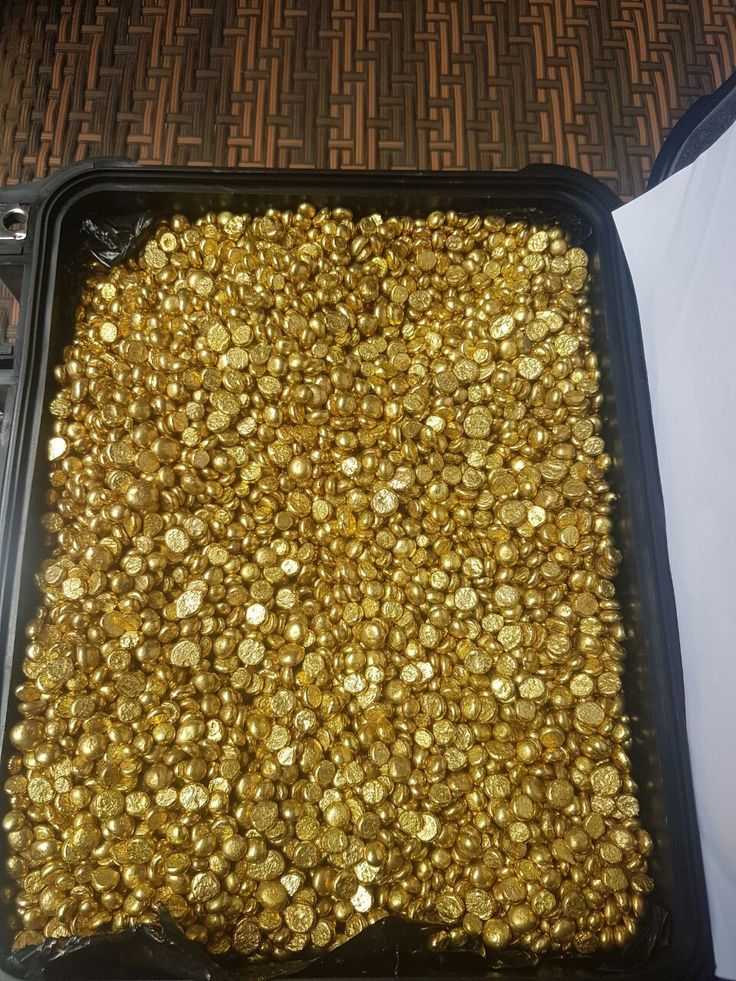A picture of Gold bars and nuggets