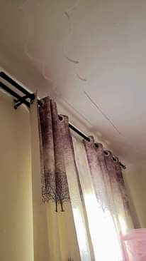 A picture of Curtains suitcase fan and mattress