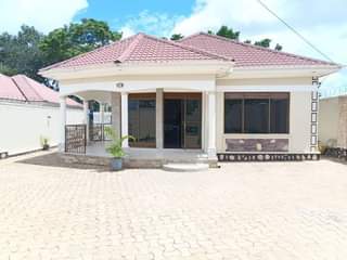 A picture of Classic white house up 4 sale Mukono_KIROWOOZA behind Uganda Christian