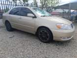 A picture of GOLD SUPER SHARP COROLLA 2006 IN A STANDARD GRADE AC