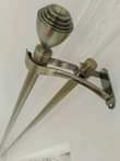 A picture of Curtain rods hooks and tiebacks