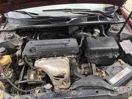 A picture of Toyota Camry 2004 4 plug Painted but not neatly Engine