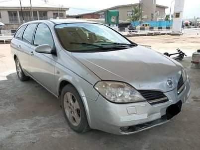 A picture of WAGON USED BY A LADY 2005 NISSAN PRIMERA WITH REVERSE