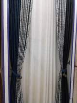 A picture of Curtains and rode