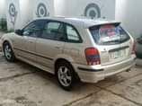 A picture of Mazda 323 neatly