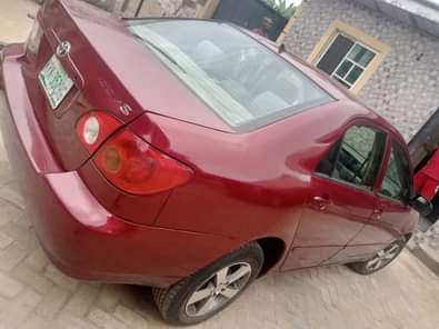 A picture of Toyota Corolla red with silent engine sharp gear and chilling