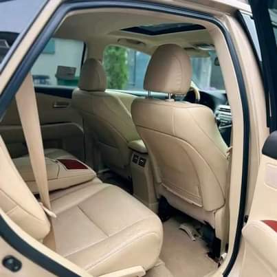 A picture of DIRECT TOKUNBO 2010 LEXUS RX350 FULL OPTION. Gold on cream