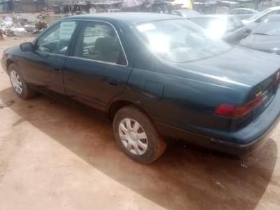 A picture of Toks standard. Toyota Camry bought by first user barely driving.