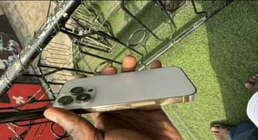A picture of iPhone 14 pro 128gb gold
