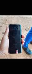 A picture of IPhone 11 Samsung s8 and s8