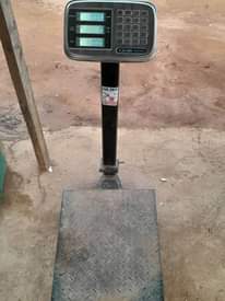 A picture of 50 60Kg Gas Cylinder with Scale and Gas pumping machine