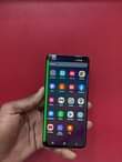 A picture of samsung S10 with green line at 380k call on 0753430863