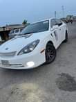 A picture of Am here again with this cool Lexus I no dey