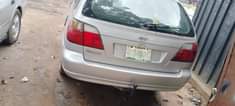 A picture of Nissan Almeria going for 900k plus 50k settlement location uyo
