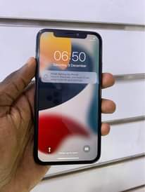 A picture of iPhone X 256gb faceid working 770k WhatsApp or call 0759979422