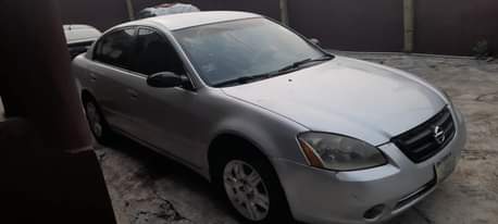 A picture of DELAY IS DANGEROUS 2004 NISSAN ALTIMA Painted on first body