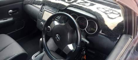 A picture of Nissan tiida on sale 55000 negotiable it needs 2coils and