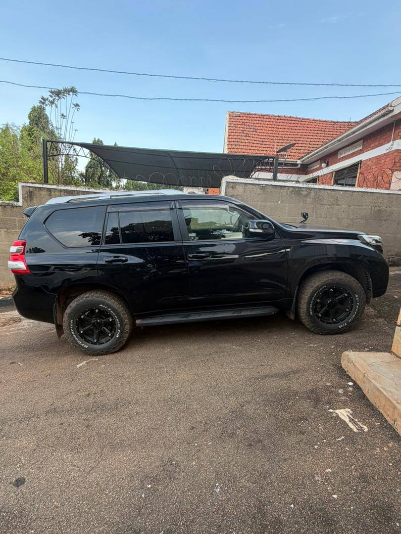 A picture of Chinese client leaving Uganda selling 8 months old Prado Tx