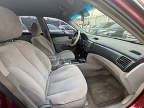 A picture of Kia Optima 2006 model Engine Gear and AC is perfect