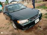 A picture of Toyota Corolla is available with good condition engine and gear