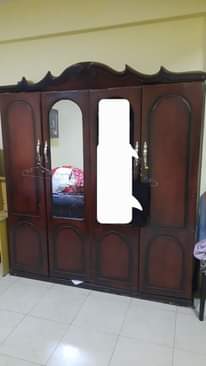 A picture of highchair lamp n cupboard