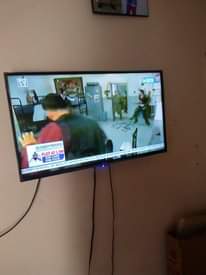 A picture of Lshaped chairs and TV
