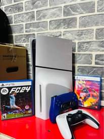 A picture of Sony PS5 slim version combo with 2controllers 2games FIFA and