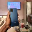 A picture of samsung A12 0655695769 128gb ram 4 BEI 250 000 Finger