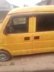 A picture of Susuki Mini Bus currently plying the road with gear that