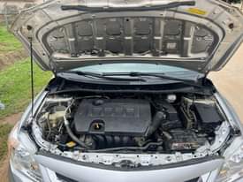 A picture of 8m with sambo 2013 Toyota Corolla on belt with untampered