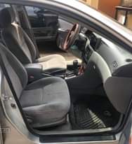 A picture of Clean Nigerian Used Silver Toyota Corolla 2003 Repainted Fabric interior