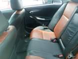 A picture of very dope 2010 toyota corolla neatly flashed engine very mint