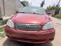 A picture of Toyota Corolla 2006 Color Red Properly Used Baked on First