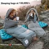 A picture of Camping tents air mattresses and sleeping bags