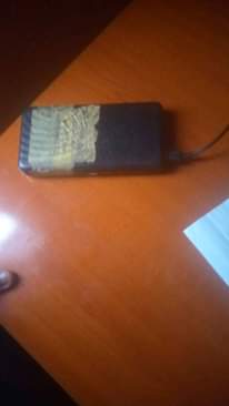 A picture of Techno spark 3 with 20000mha power bank for swap with