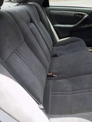 A picture of Toyota Camry tiny light Sound engine AC needs gas Gear