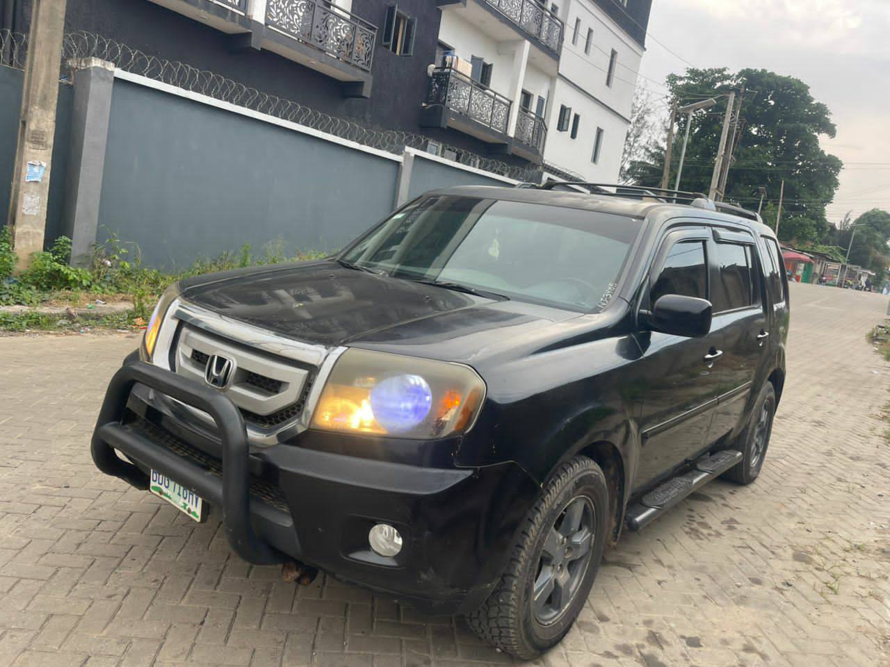 A picture of Honda Pilot 2011 Registered 5.7m first body pan at Ogba