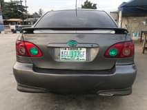 A picture of Toyota camry 2007 with a unique green light