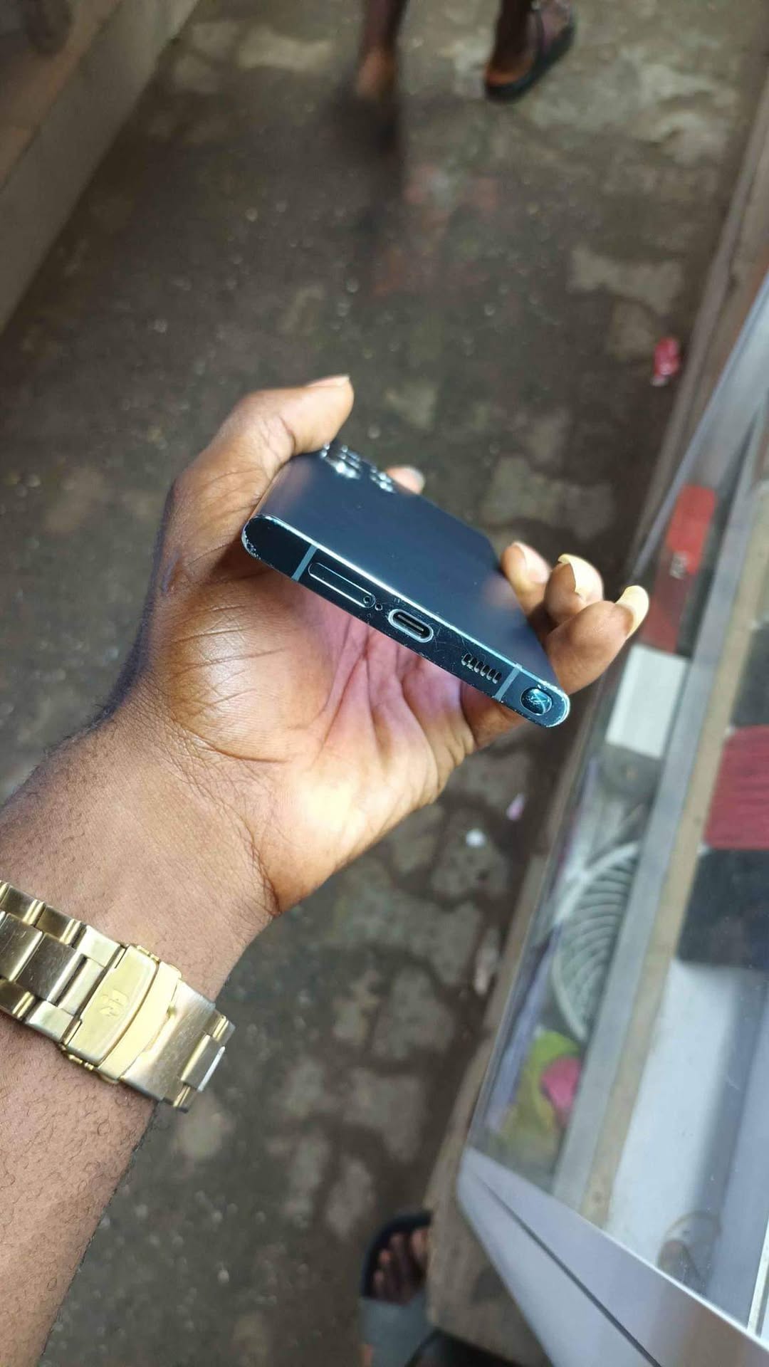 A picture of Samsung s22 ultra slight cracked screen at the top left