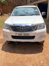 A picture of Hilux Vigo and TVS Star on sale location Luzira kirombe