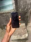 A picture of Iphone x no face id with little color line on