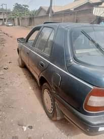 A picture of Nissan Sunny lift back is available with good condition
