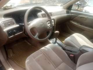 A picture of Toks standard. Toyota Camry bought by first user barely driving.