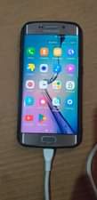 A picture of Samsung s6 EDGE GOOD HAS NEW ONLY THE CRACKS ON