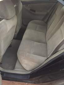 A picture of Toyota Corolla 2003 do car is 1st body engine and