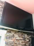 A picture of Popcorn machine.phillips tv 48inch.desktop computer