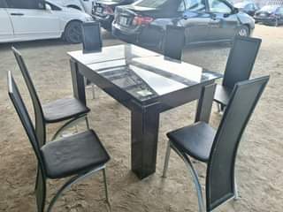 A picture of Near dining table set with 6 pairs of chair.