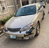 A picture of AWOOF Fastest buyer needed. 2004 Toyota Camry. Engine smoking. 1.450m